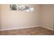 Cozy bedroom showcasing tiled floors, neutral walls, and a bright window at 4572 33Rd N Ave, St Petersburg, FL 33713