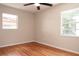 Sun-filled bedroom featuring hardwood floors and two windows letting in tons of natural light at 4572 33Rd N Ave, St Petersburg, FL 33713