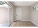 Bright bonus room featuring tile flooring, a sliding glass door, and abundant natural light at 4572 33Rd N Ave, St Petersburg, FL 33713