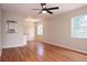 Inviting living room featuring gleaming hardwood floors, a ceiling fan, and ample natural light at 4572 33Rd N Ave, St Petersburg, FL 33713