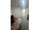 Bedroom featuring carpeted floors, neutral colored walls, desk, and large closet with white doors at 4743 Deer Track St, Tampa, FL 33610