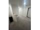 Bright hallway featuring carpeted floor, white walls, closet, and access to the staircase at 4743 Deer Track St, Tampa, FL 33610