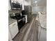 Well-equipped kitchen featuring stainless steel appliances and granite countertops at 4743 Deer Track St, Tampa, FL 33610