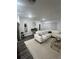 Stylish living room with a sectional sofa, modern decor, and contemporary lighting at 4743 Deer Track St, Tampa, FL 33610
