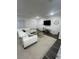 Bright living room featuring a comfortable sectional sofa and modern decor at 4743 Deer Track St, Tampa, FL 33610