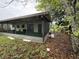 Backyard featuring screened in porch and various foliage at 4920 S 82Nd St, Tampa, FL 33619