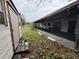 Photo of the overgrown backyard with shed and screened in porch at 4920 S 82Nd St, Tampa, FL 33619
