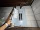Electrical panel box in an unfinished basement with cinder block walls at 4920 S 82Nd St, Tampa, FL 33619