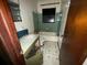 Bathroom with a sink and vanity, toilet, tub and shower, and blue and white tiled floor at 4920 S 82Nd St, Tampa, FL 33619