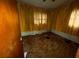 Bedroom featuring brown carpet, yellow curtains, and a ceiling fan at 4920 S 82Nd St, Tampa, FL 33619