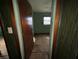View through a doorway into a bedroom features a window and a ceiling fan at 4920 S 82Nd St, Tampa, FL 33619