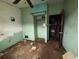 Bedroom with painted walls, built-in closet, and doorway to another room at 4920 S 82Nd St, Tampa, FL 33619