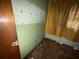 Dated bedroom showcasing patterned wallpaper and yellow curtains at 4920 S 82Nd St, Tampa, FL 33619