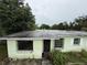 Exterior view of the house showcasing the roof and showing the front entry at 4920 S 82Nd St, Tampa, FL 33619