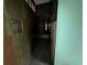 The hallway features wood-paneled walls and a view of the interior at 4920 S 82Nd St, Tampa, FL 33619