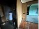 Hallway view shows doorway and some needed repairs at 4920 S 82Nd St, Tampa, FL 33619