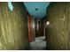 A hallway showing doors and wood-paneled walls with a view of the interior at 4920 S 82Nd St, Tampa, FL 33619