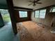Spacious living room with plenty of natural light and classic ceiling fan at 4920 S 82Nd St, Tampa, FL 33619