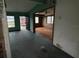 View of the living room features an open layout and an exterior view through the doorway at 4920 S 82Nd St, Tampa, FL 33619