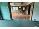 A view of the house showcasing a dirty carpet and dated wood paneling at 4920 S 82Nd St, Tampa, FL 33619