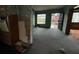 Living room in need of renovation with peeling walls and bare floors at 4920 S 82Nd St, Tampa, FL 33619