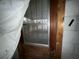 Wooden door with security bars and a screen leading to a covered porch at 4920 S 82Nd St, Tampa, FL 33619