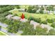 Beautiful aerial view of the property with golf course and pond in the community at 5143 Lochmead Ter, Zephyrhills, FL 33541