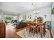 Open-concept living space featuring a dining area, comfortable seating, and natural light at 5143 Lochmead Ter, Zephyrhills, FL 33541