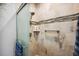 Modern bathroom featuring a glass-enclosed shower with updated fixtures and tiled walls at 5143 Lochmead Ter, Zephyrhills, FL 33541