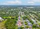 An aerial view of a home on a long lot in a wooded neighborhood at 6043 Piedmont Dr, Spring Hill, FL 34606
