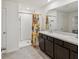 Bathroom with dual sink vanity, walk-in shower, and contemporary fixtures at 6043 Piedmont Dr, Spring Hill, FL 34606