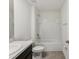 Bright bathroom featuring a granite-look countertop, white fixtures, and a tiled shower-tub combination at 6043 Piedmont Dr, Spring Hill, FL 34606