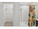 Bathroom with a walk-in shower, closet, and modern fixtures at 6043 Piedmont Dr, Spring Hill, FL 34606