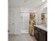 Well-lit bathroom featuring a walk-in shower, and modern vanity at 6043 Piedmont Dr, Spring Hill, FL 34606