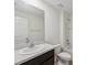 Bright bathroom featuring a granite-look countertop, white fixtures, and a shower-tub combination at 6043 Piedmont Dr, Spring Hill, FL 34606