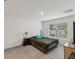 Bedroom featuring plush carpet, a window with blinds, and a neutral color palette at 6043 Piedmont Dr, Spring Hill, FL 34606
