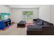 A spacious bonus room provides flexibility and comfort with a window overlooking the outdoors at 6043 Piedmont Dr, Spring Hill, FL 34606