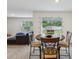 The dining room table looks out onto the large backyard at 6043 Piedmont Dr, Spring Hill, FL 34606