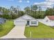 Single-Gathering home with a neatly manicured lawn and a paved driveway at 6043 Piedmont Dr, Spring Hill, FL 34606