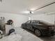 Clean, organized garage with vehicle, storage, and white walls at 6043 Piedmont Dr, Spring Hill, FL 34606