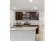 Well-equipped kitchen with modern appliances, ample countertop space, and stylish cabinetry at 6043 Piedmont Dr, Spring Hill, FL 34606