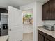 Walk-in pantry stocked with supplies, providing ample storage space at 6043 Piedmont Dr, Spring Hill, FL 34606