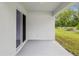 Covered patio with a concrete floor, offering a perfect outdoor space for relaxation and entertaining at 6043 Piedmont Dr, Spring Hill, FL 34606