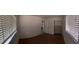 Bright bedroom featuring wood floors, two windows, and neutral paint at 6474 29Th N Ave, St Petersburg, FL 33710