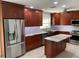 Modern kitchen featuring stainless steel appliances, an island, and beautiful wooden cabinetry at 6474 29Th N Ave, St Petersburg, FL 33710