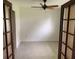 Bright office space featuring a ceiling fan, neutral walls, and beautiful french doors at 6474 29Th N Ave, St Petersburg, FL 33710