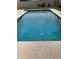 Refreshing blue swimming pool surrounded by a well-maintained concrete deck at 6474 29Th N Ave, St Petersburg, FL 33710