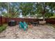 Paver patio with outdoor seating, a dining area, a grill, and a fire pit at 670 42Nd Ne Ave, St Petersburg, FL 33703