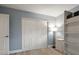 Bedroom with large closet, neutral walls and light gray wood-look flooring at 670 42Nd Ne Ave, St Petersburg, FL 33703