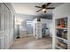 Cozy bedroom features a loft bed with a built-in desk and sleek gray wood-look flooring at 670 42Nd Ne Ave, St Petersburg, FL 33703